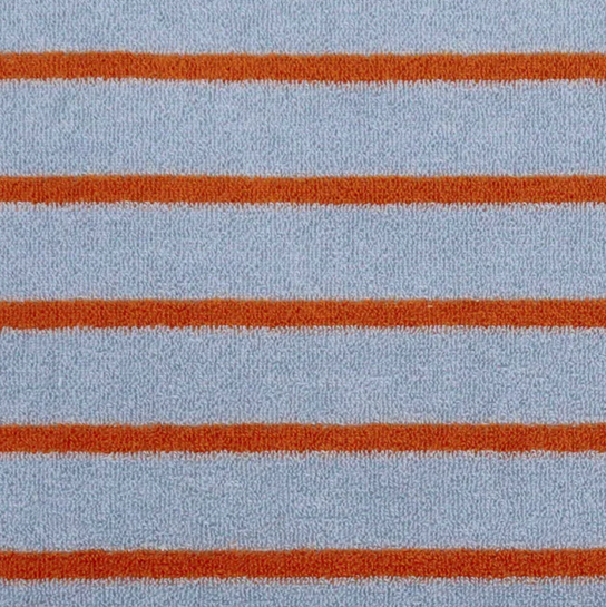 Cotton towelling fabric with horizontal brown stripes on a light blue absorbant cotton