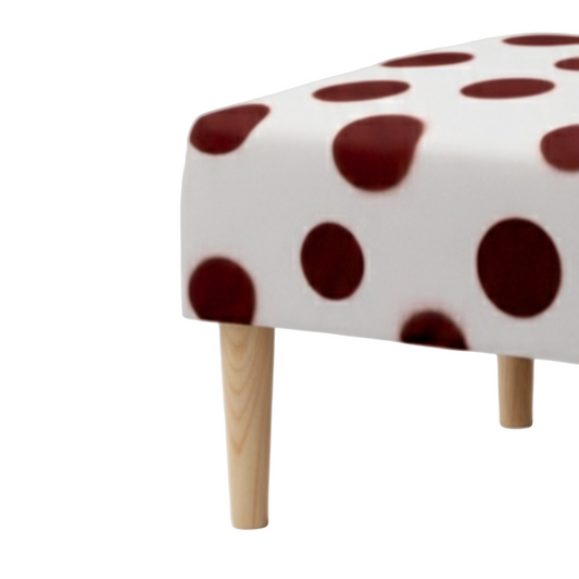 Small stool with polka dot pattern on a white background