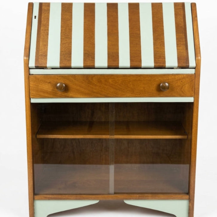 Wooden desk with striped top on a white background